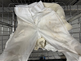 dirty baseball pants sent to Reload Laundry